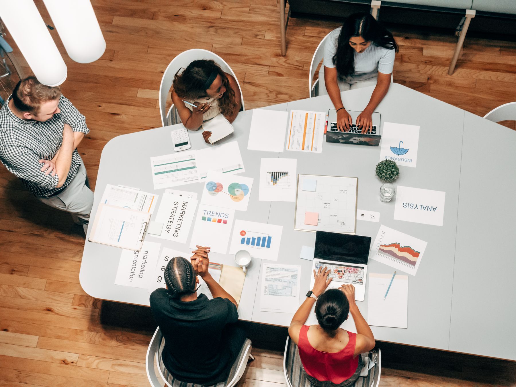 Small business web design plans and analytics on a desk